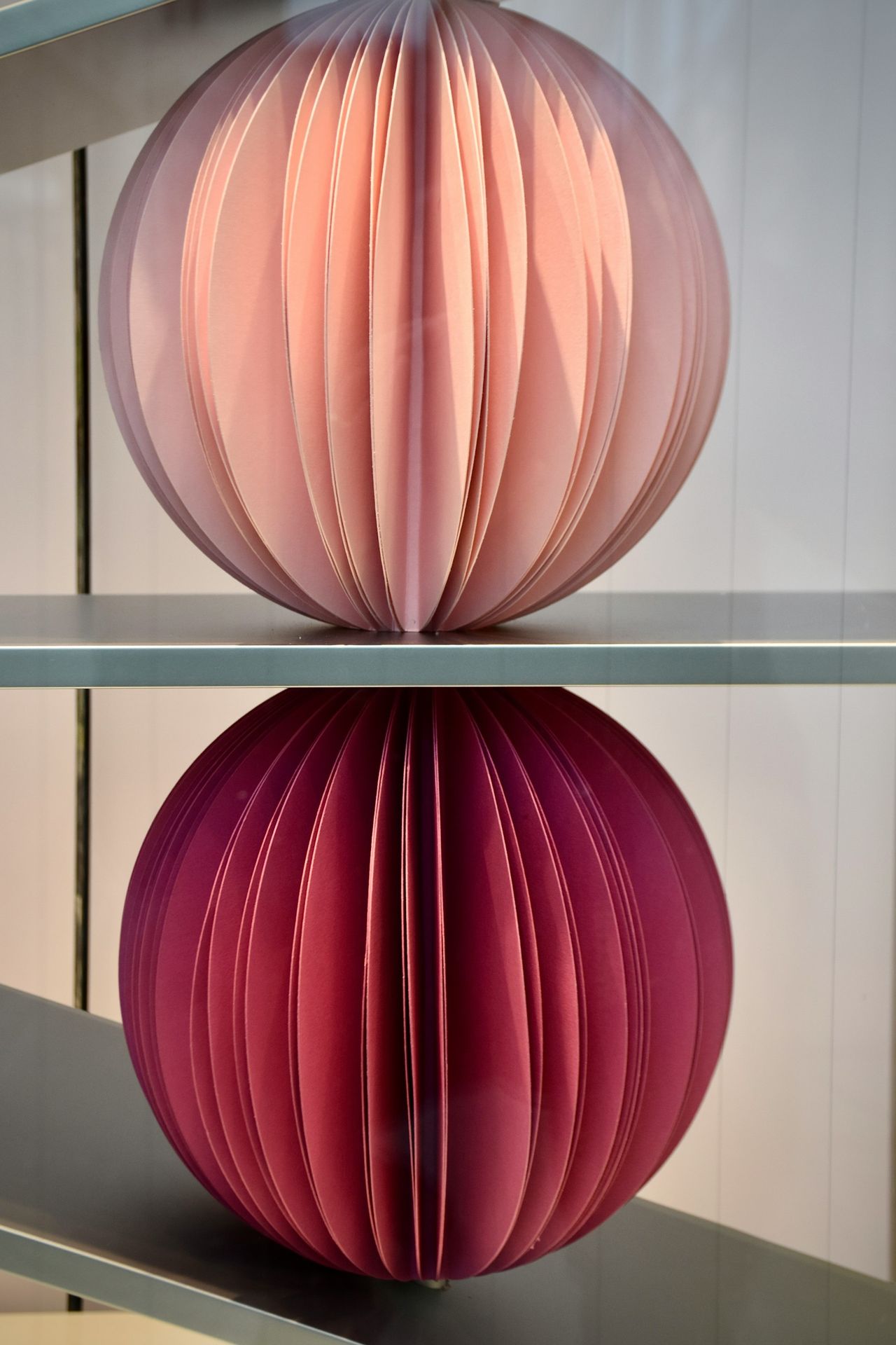 a close up of a paper ball on a shelf